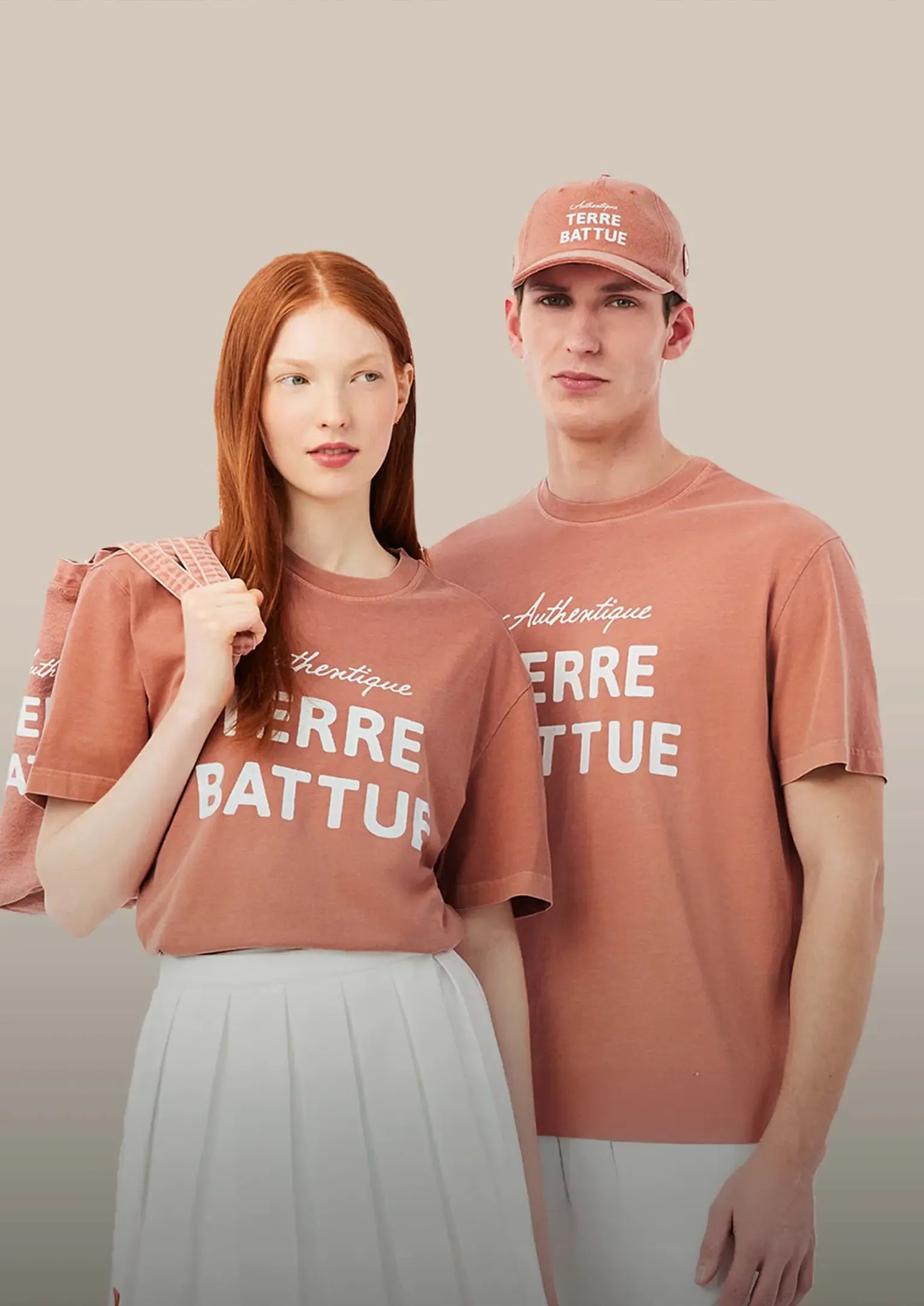 Man and Woman wearing Lacoste Terre Battue T-shirts