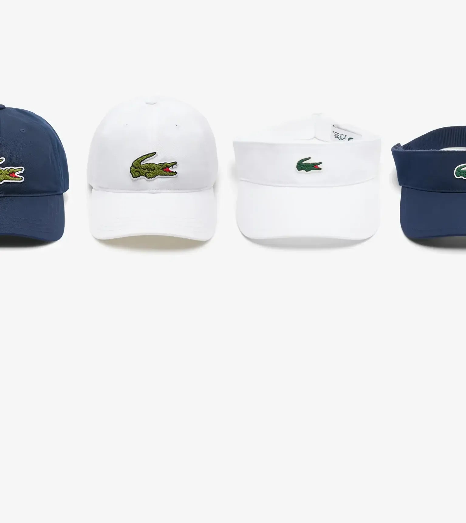 Four Lacoste caps and visors on a white background