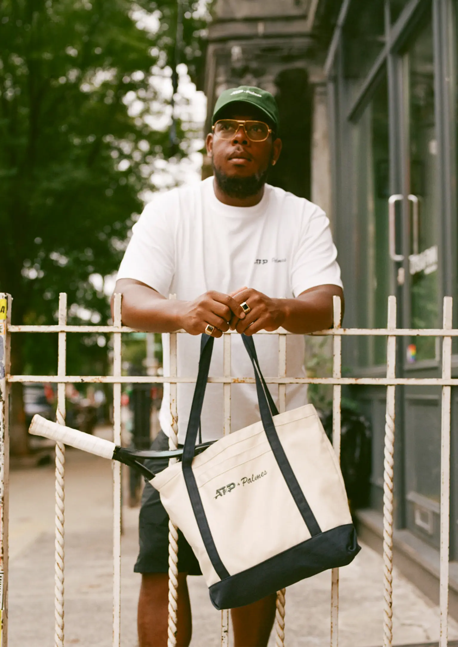 Person holding a Palmes tote bag with a blurred background