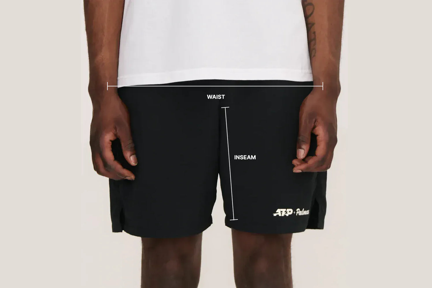 Black Palmes shorts with measurements labeled on a plain background